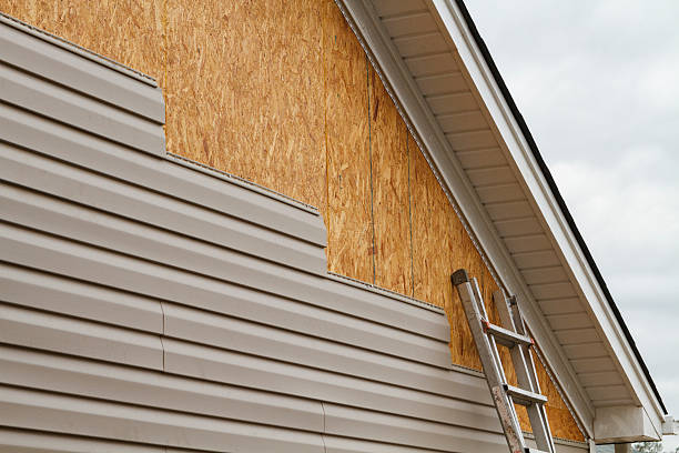Professional Siding Contractor technician working in Enon, OH